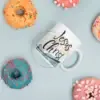 White glossy mug with donuts